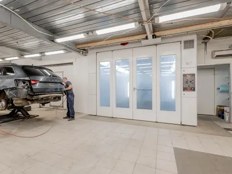 Clean service bay with a car on a lift